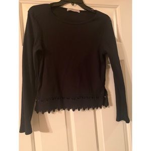 Black shirt with leaf details on bottom